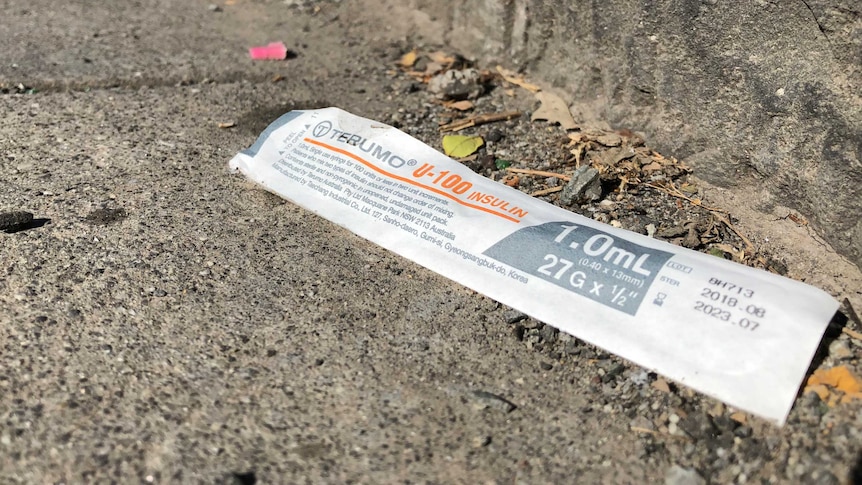 A empty syringe packet on the ground near the Melbourne safe injecting centre in North Richmond.