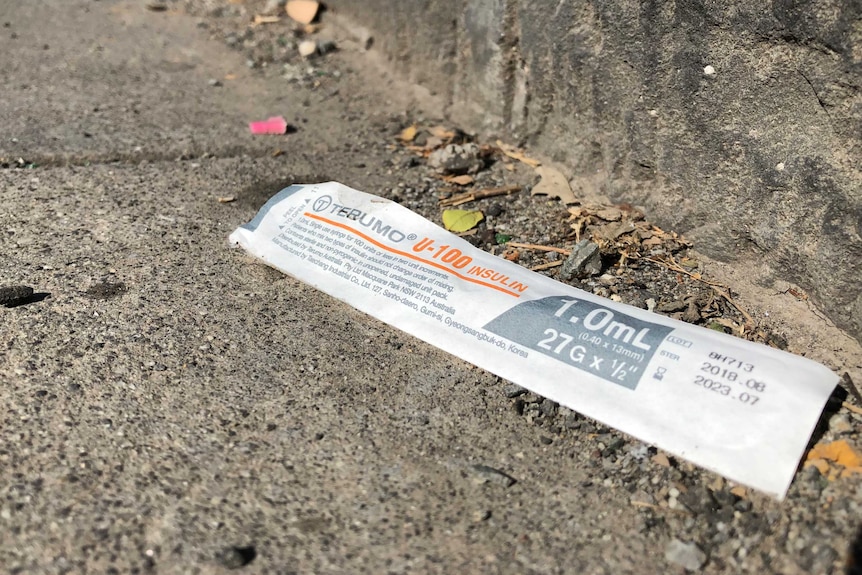 A empty syringe packet on the ground near the Melbourne safe injecting centre in North Richmond.