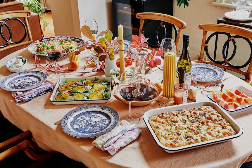 Food on a table with wine and candles