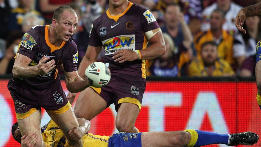 Captain's knock: Lockyer sets up a another try for the Broncos.
