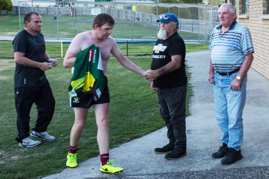 Player comes off the ground at amateur football training, Tasmania.