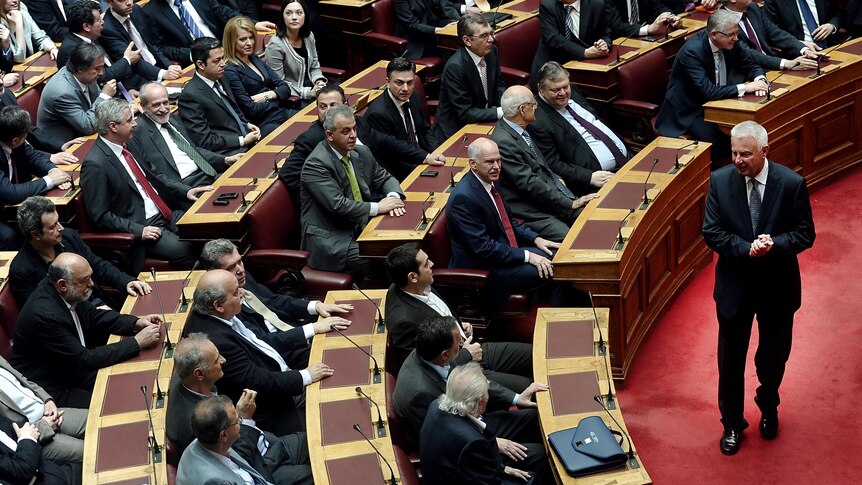 Panagiotis Pikrammenos arrives at the Greek parliament.