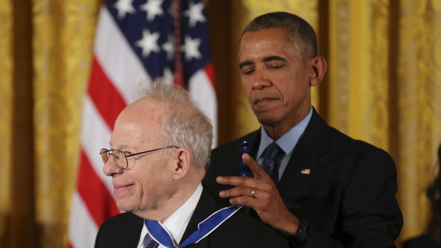 Richard Garwin smiles as he is presented the presidential medal of freedom by us president Barack Obama