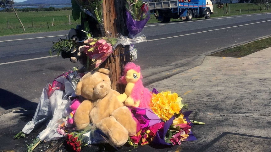 Flowers and teddies at the scene of a double fatality in Tasmania