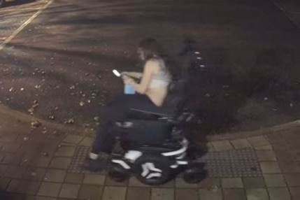 A woman on an electric wheelchair