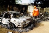 Rescue worker inspects Nigeria bomb blast site
