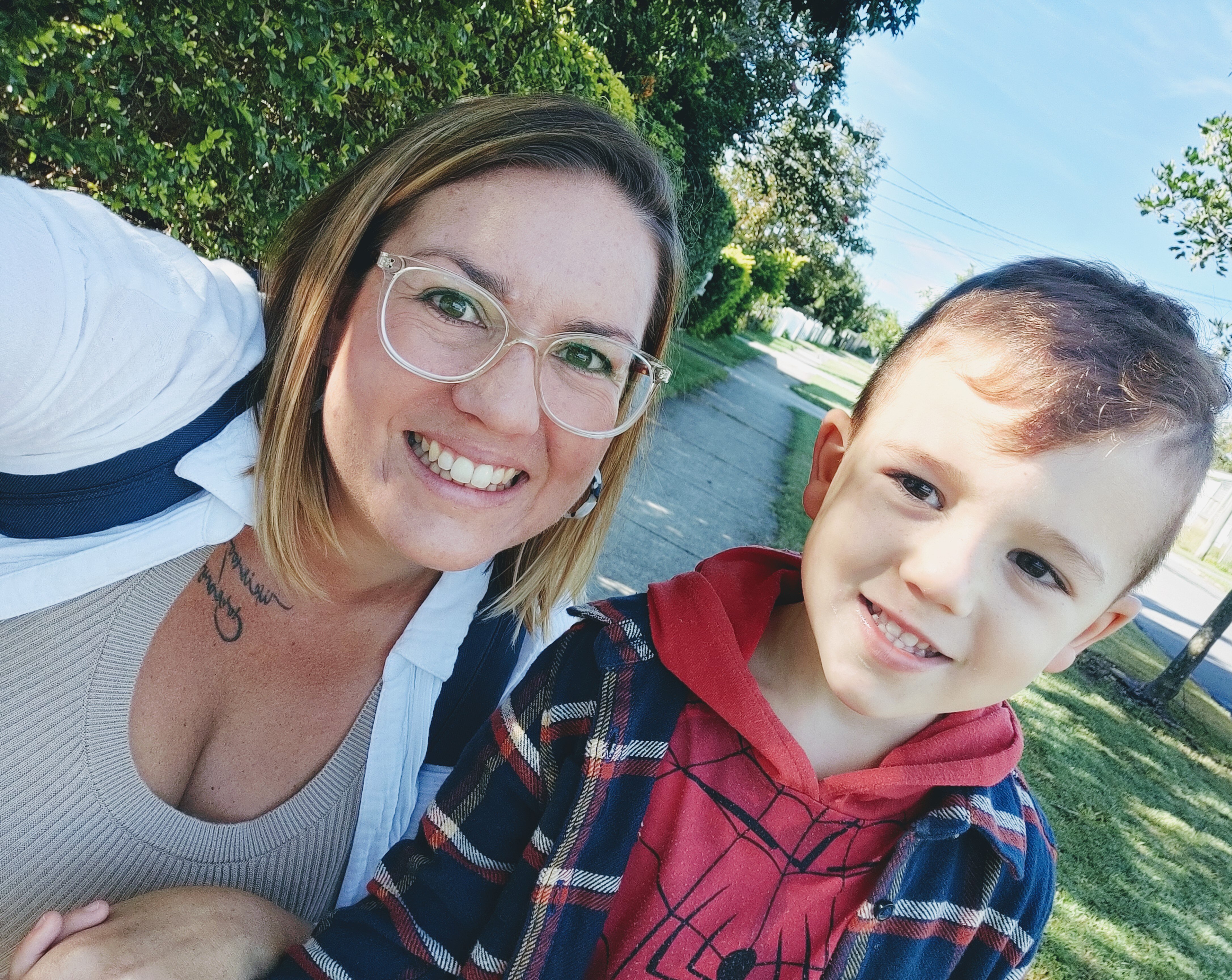 An image of Laura Brown smiling with her son