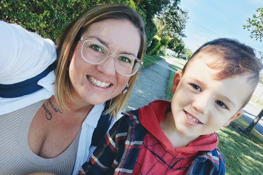An image of Laura Brown smiling with her son
