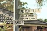 Street sign reading Alfred Hill Drive. 