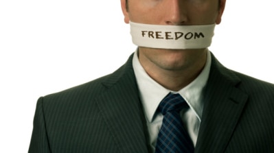 File photo of man man with tape across mouth, with word 'Freedom' written across it. (Thinkstock: Hemera)