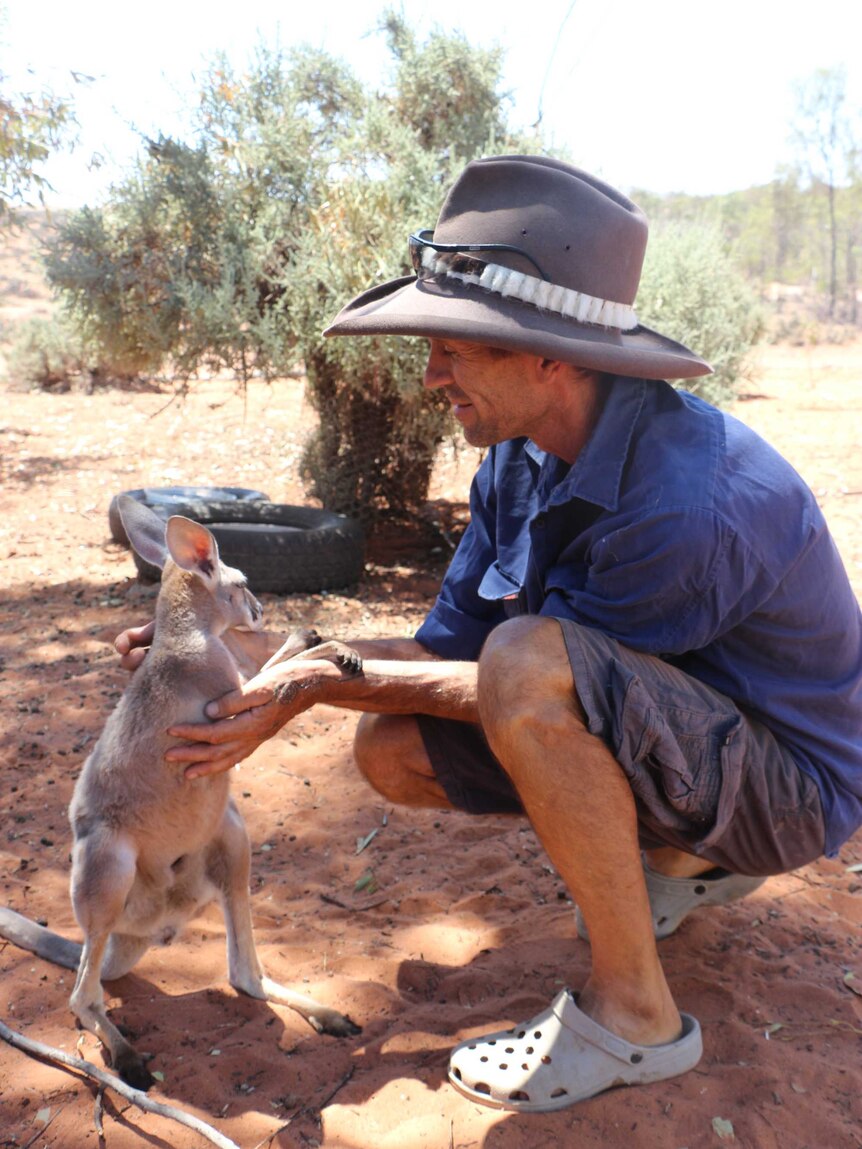 Gill Wheadon with a joey at the Menindee sanctuary.