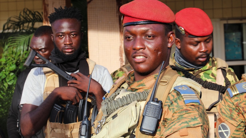 Burkina Faso's new military leader Ibrahim Traore is escorted by soldiers in Ouagadougou.