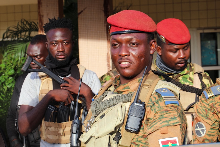 Burkina Faso's new military leader Ibrahim Traore is escorted by soldiers in Ouagadougou.