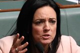 Emma Husar throws her hands up in dismay while seated in her spot in the House of Representatives next to Susan Lamb.