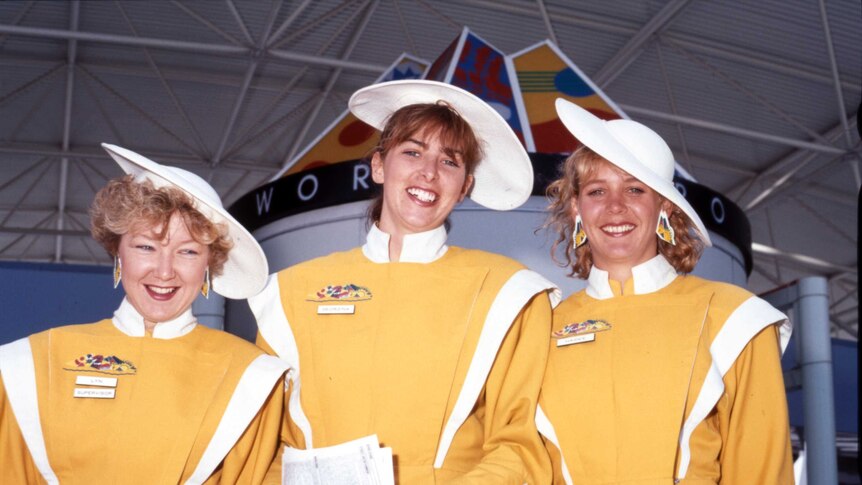 Three Expo 88 hostesses smile for a photo