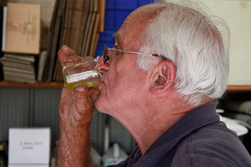 Grower Warwick Williams tests the oil.