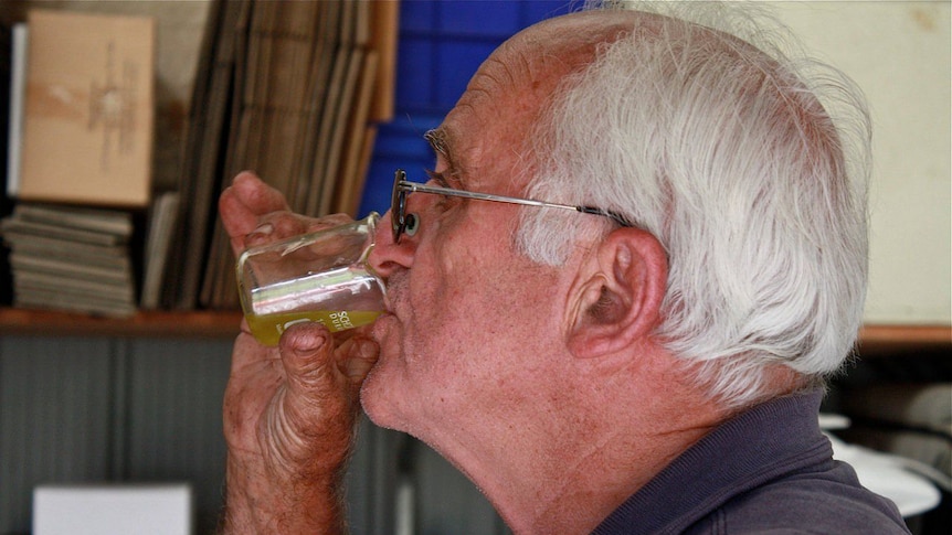 Grower Warwick Williams tests the oil.