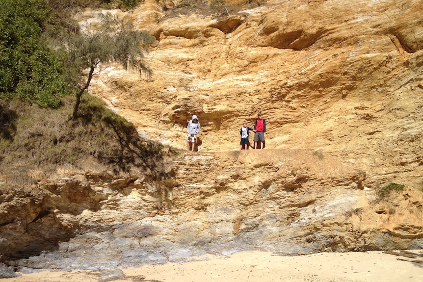 Three kids on a rockface