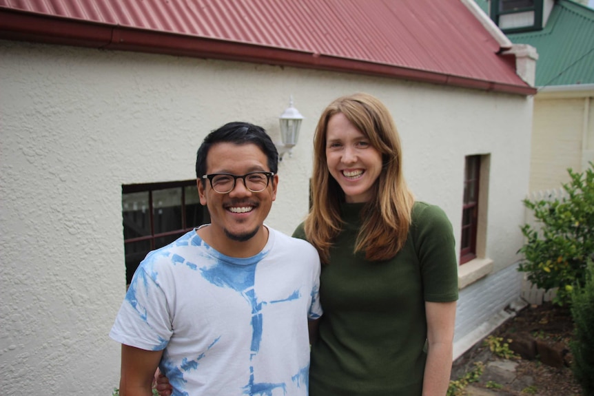 Naomi Thomson and Lee Cheong outside their Hobart home