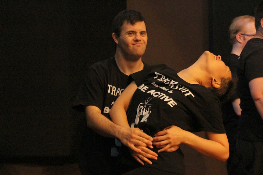 Performer Josh Bott sweeps his partner backwards during a tango.