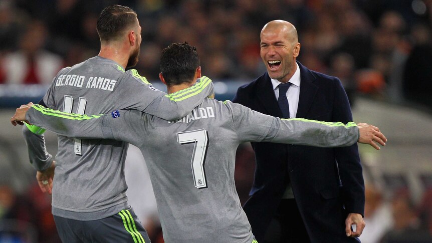Cristiano Ronaldo (C), Sergio Ramos and Zinedine Zidane (R) celebrate Real Madrid goal against Roma.