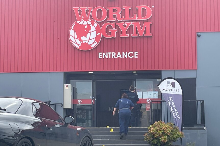 police entering a gym