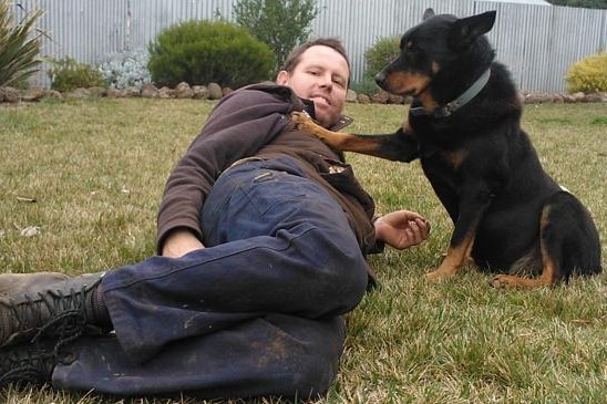 Andrew Broad MP on farm with his dog