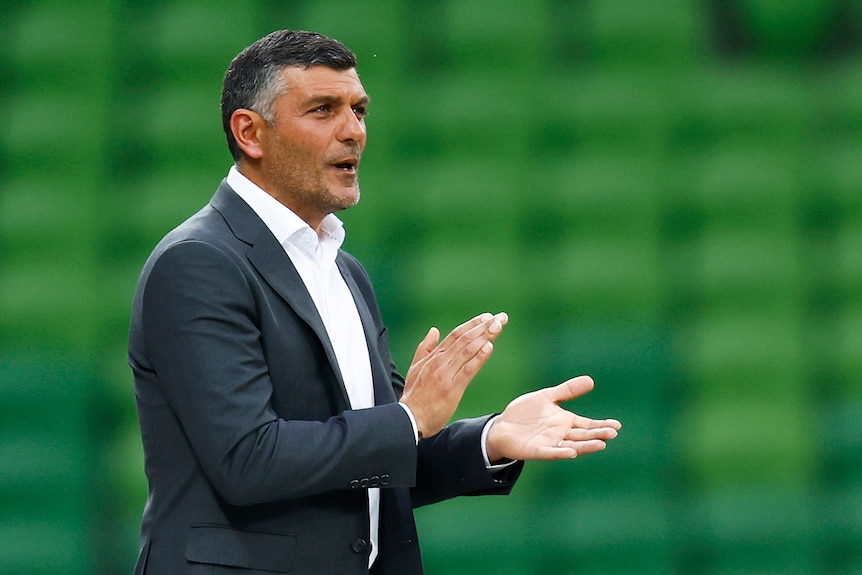 Western United A-League men coach John Aloisi claps his team from the sidelines