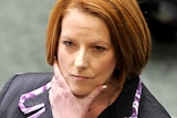 Prime Minister Julia Gillard reacts during House of Representatives question time at Parliament House