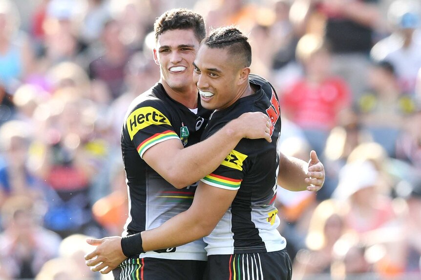 Dean Whare (R) is congratulated by Nathan Cleary after scoring a try for the Panthers.
