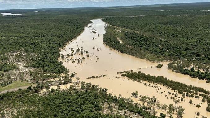 An aerial shot of a flooded outback river.