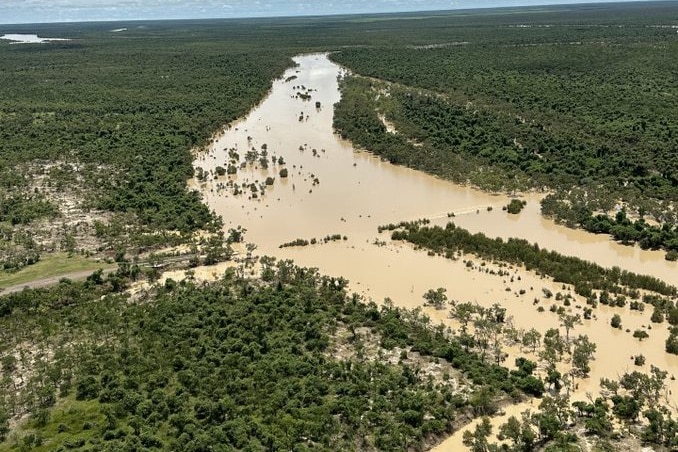 An aerial shot of a flooded outback river.