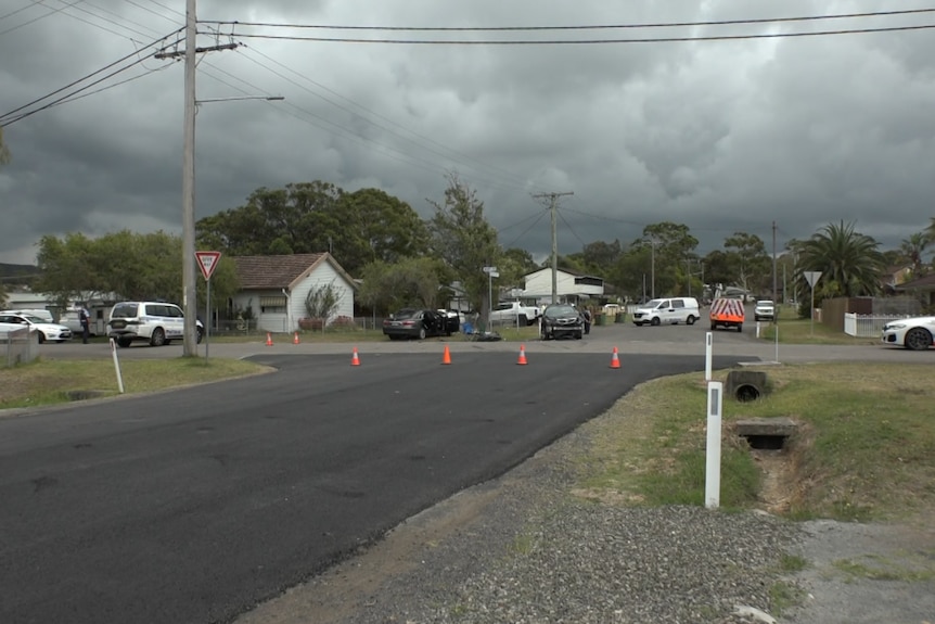 A car crash scene with police cars on site