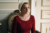 Elisabeth Moss plays Offred in a scene from The Handmaid's Tale.