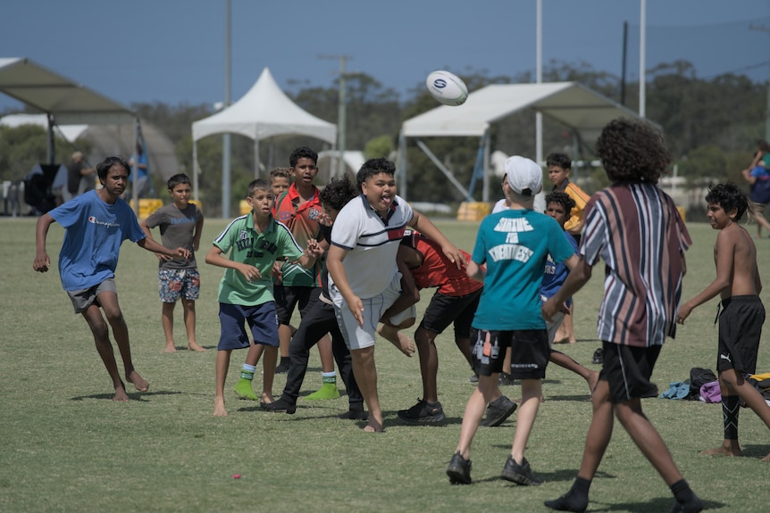 Children playing football together