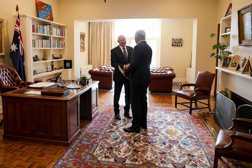 Governor-General David Hurley and Prime Minister Scott Morrison shake hands in the Governor-General's study