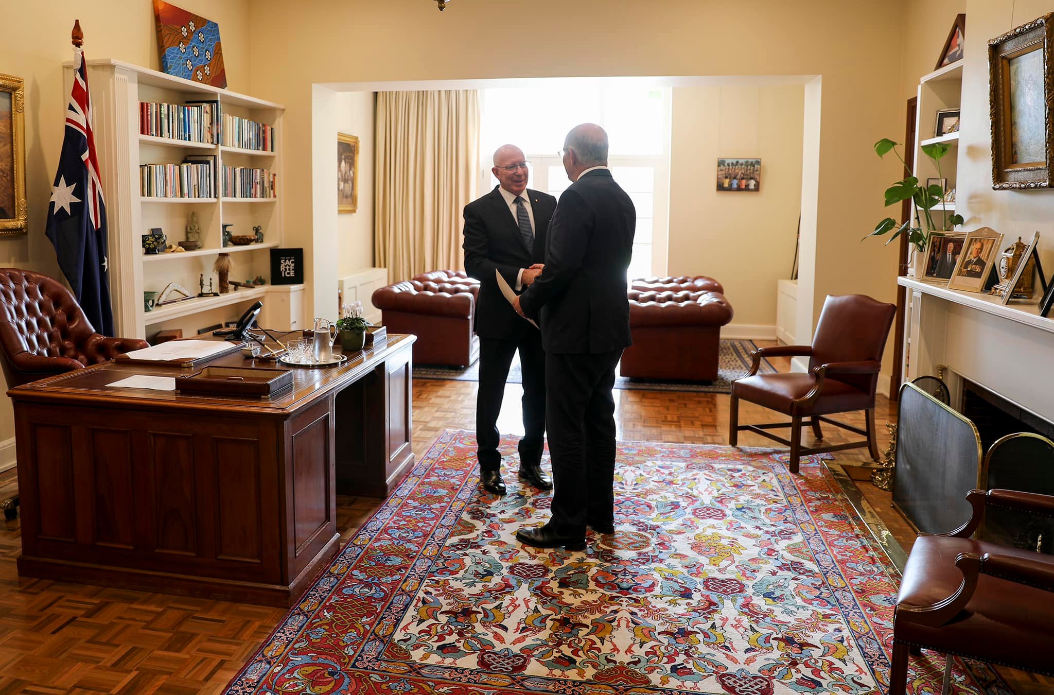 Governor-General David Hurley and Prime Minister Scott Morrison shake hands in the Governor-General's study