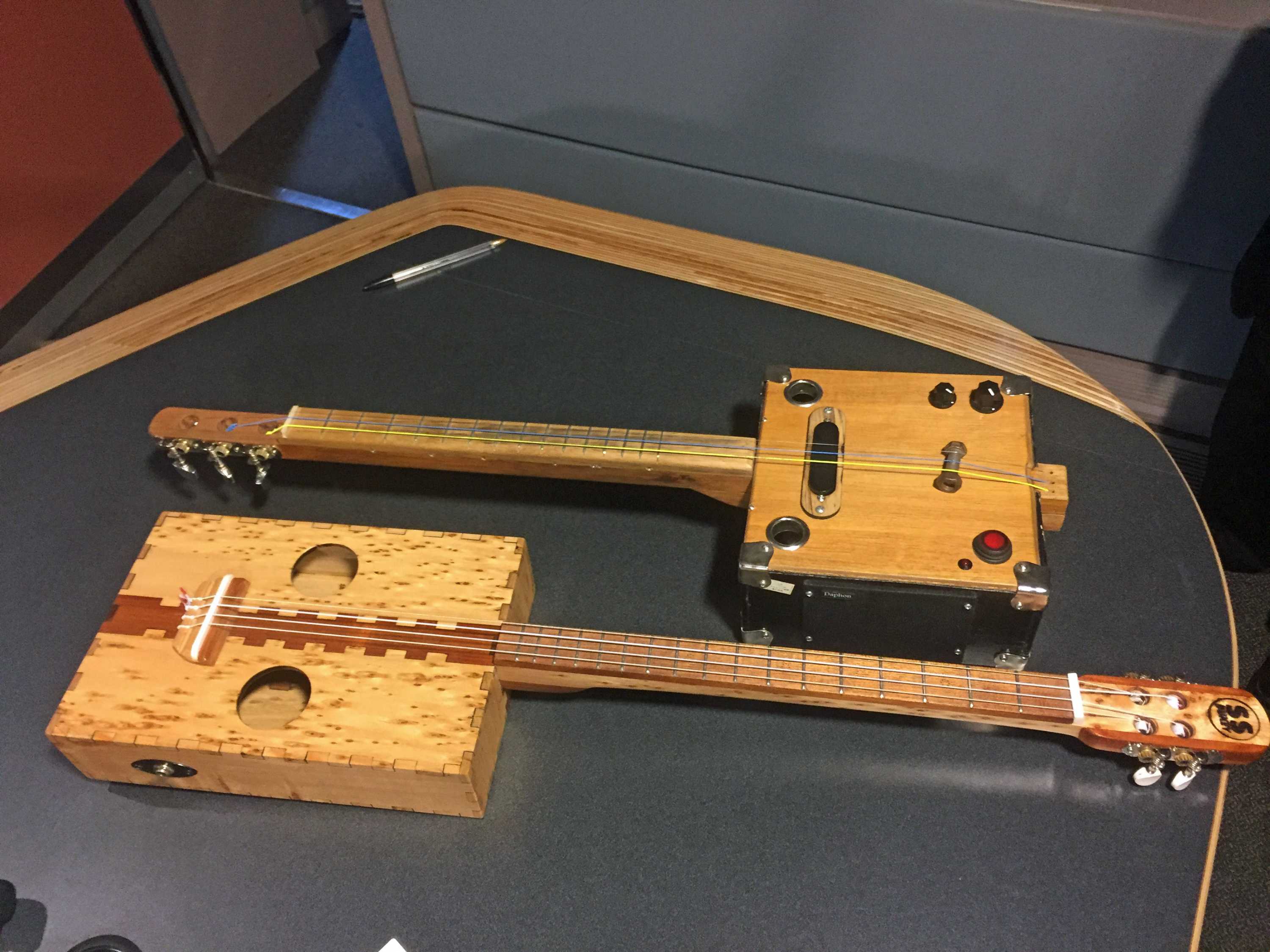 Hobart man crafting stringed instruments from recycled cigar and cheese ...