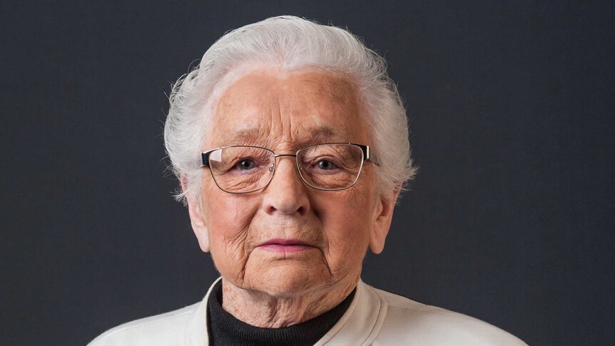 Portrait of an elderly woman wearing war medals