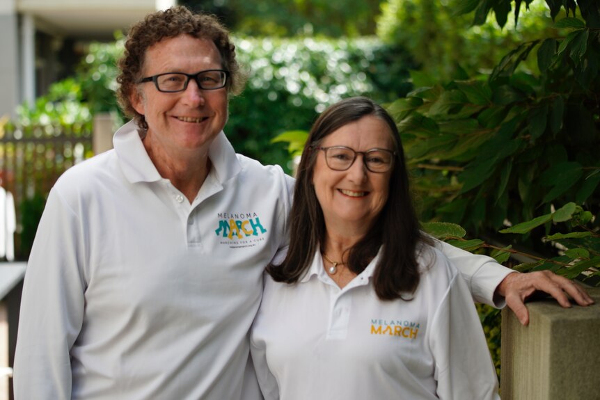 Margaret and Tony wear shirts promoting the Melanoma March.
