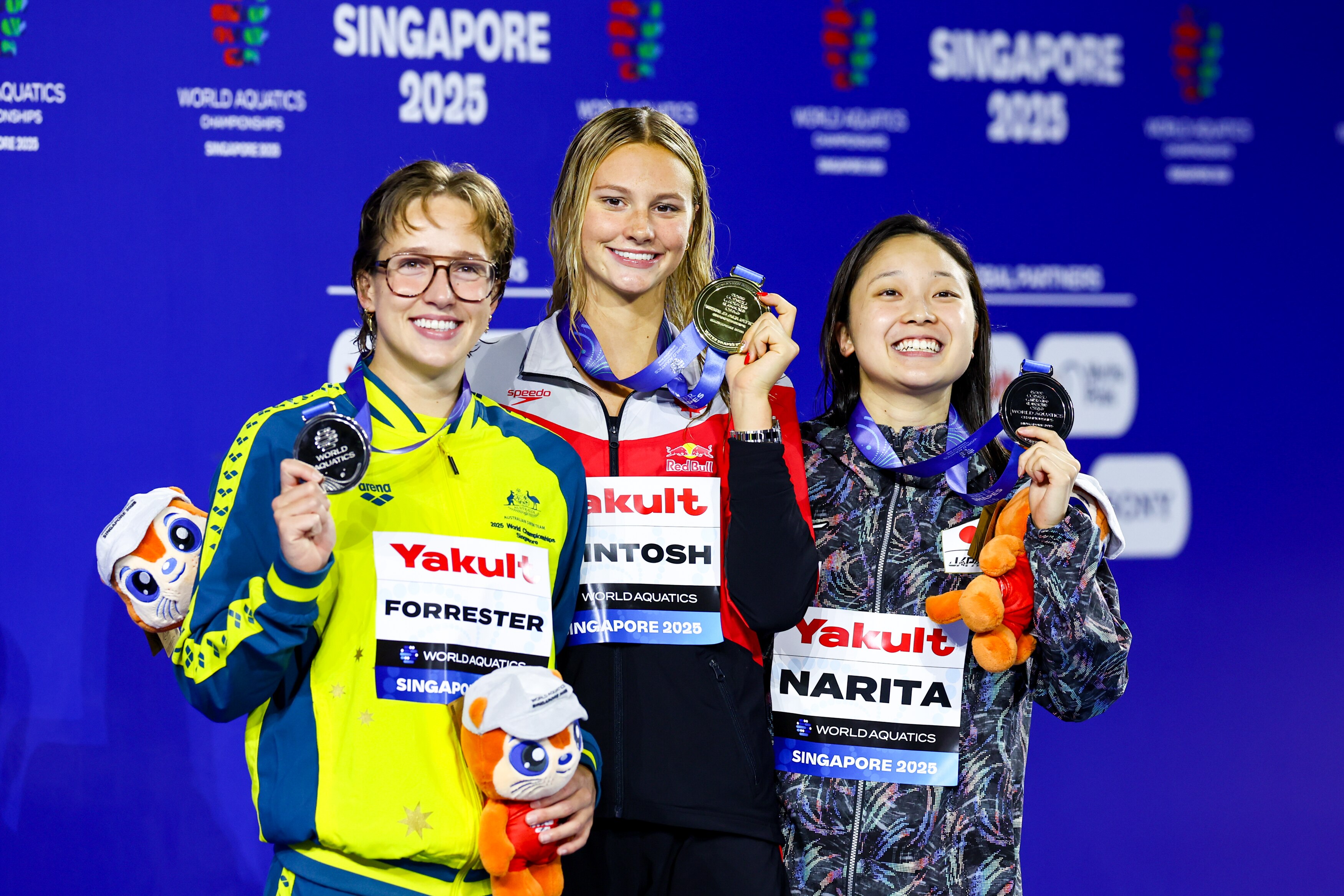 Jenna Forrester, Summer McIntosh and Mio Narita with their medals