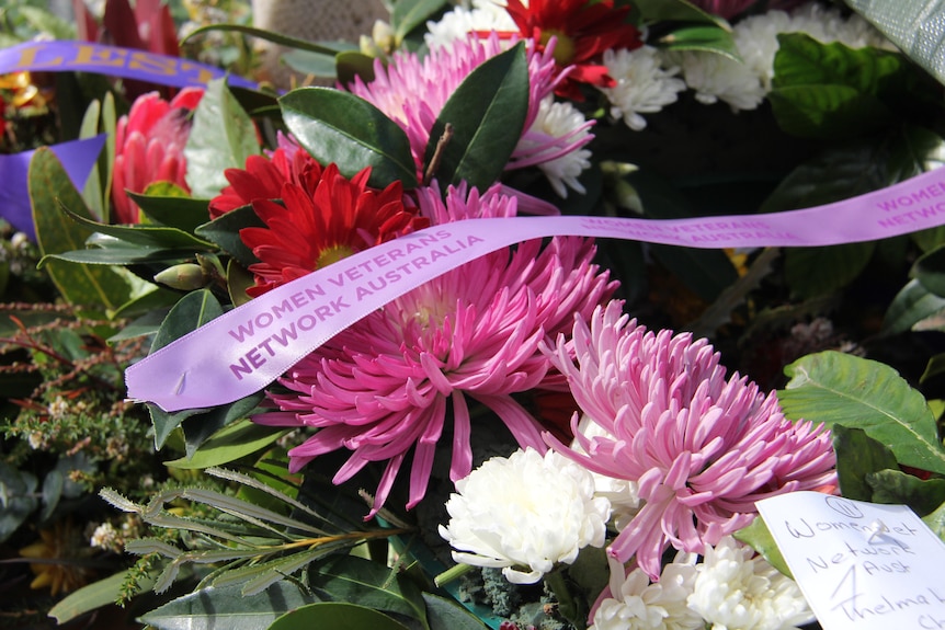 a wreath of multi coloured flowers in a wreath