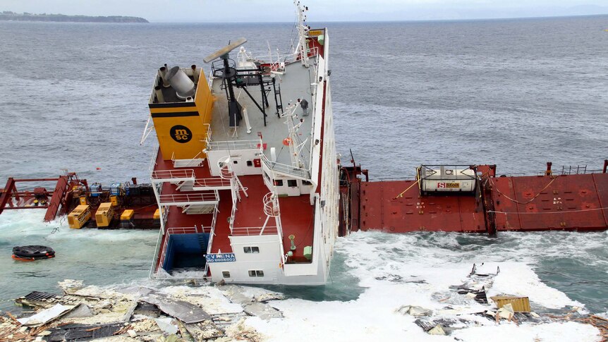 Debris covers the water around the stricken container ship Rena