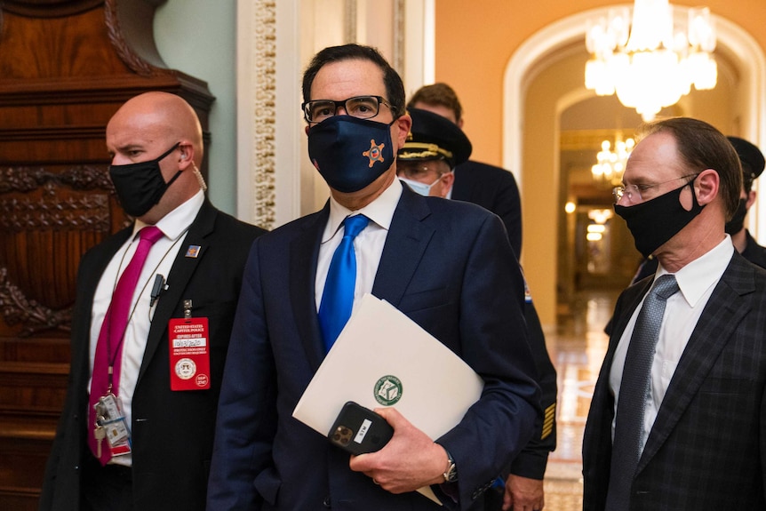 Treasury Secretary Steven Mnuchin, makes a brief comment as he leaves the Capitol,