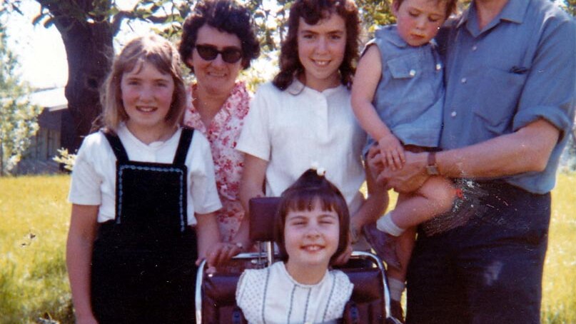 Undated photo of Lynette Rowe (on chair) with her family.
