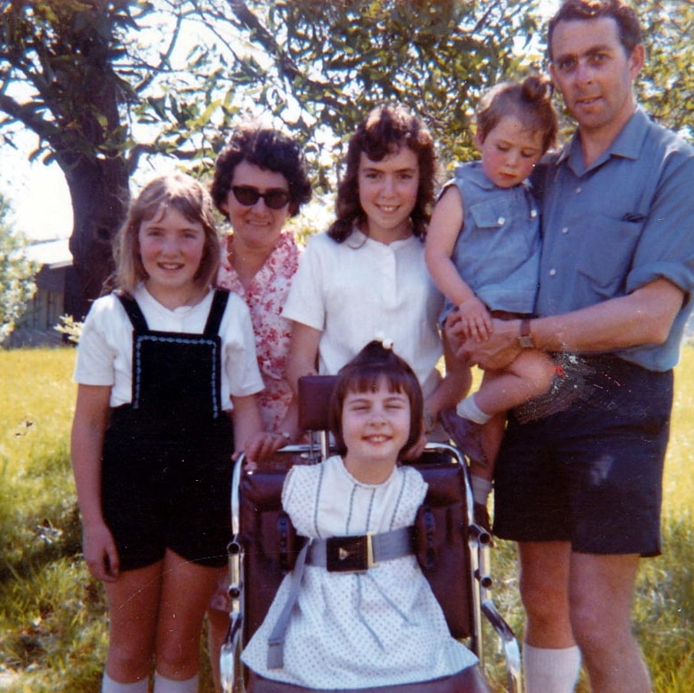 Undated photo of Lynette Rowe (on chair) with her family.