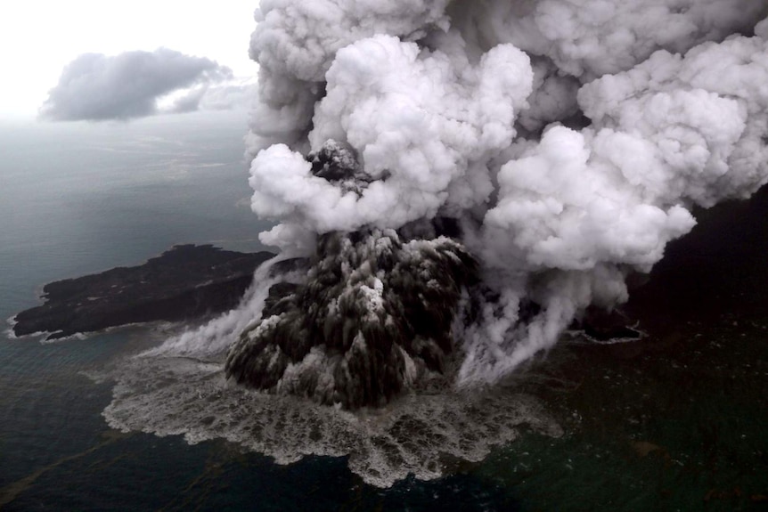 An aerial view shows smoke billowing from the Anak Krakatau volcano in Inodnesia