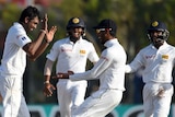 Sri Lankan cricketer Dilruwan Perera celebrates with teammates