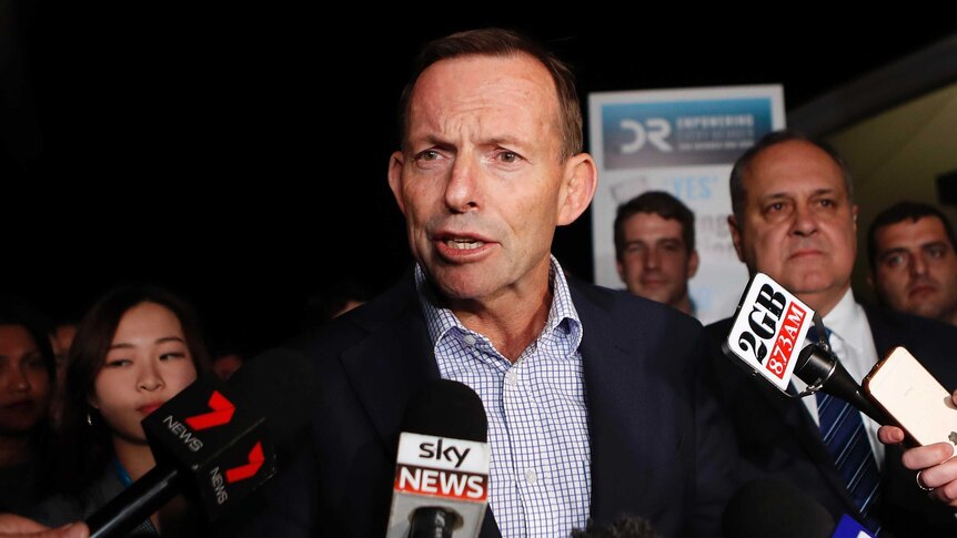 Former Prime Minister Tony Abbott talks to the media.
