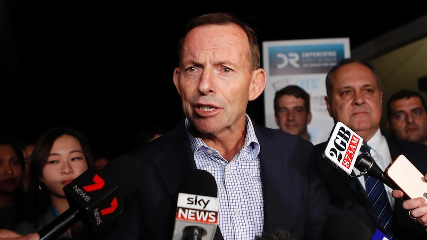 Former Prime Minister Tony Abbott talks to the media.